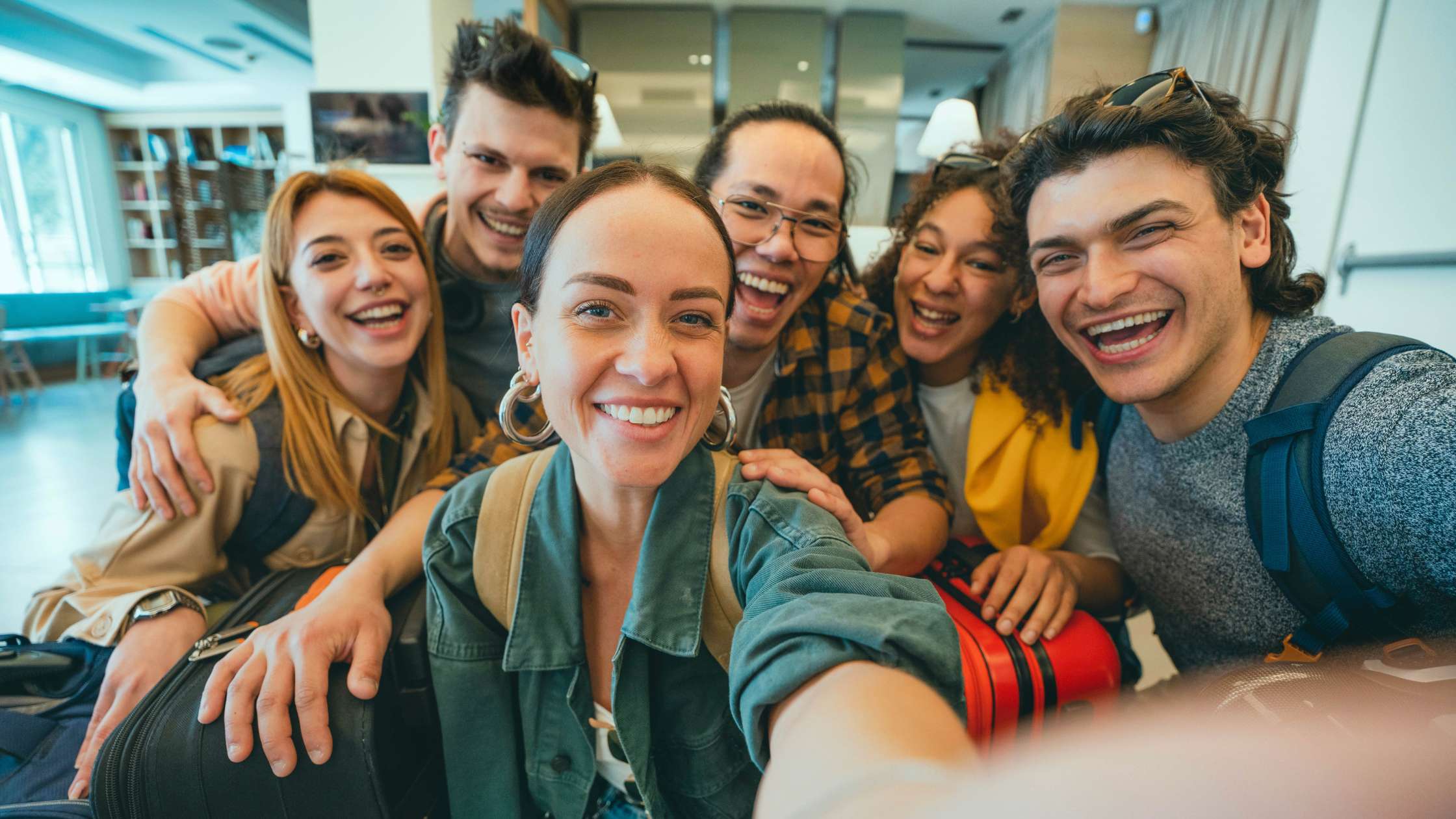 Group of friends smiling indoors