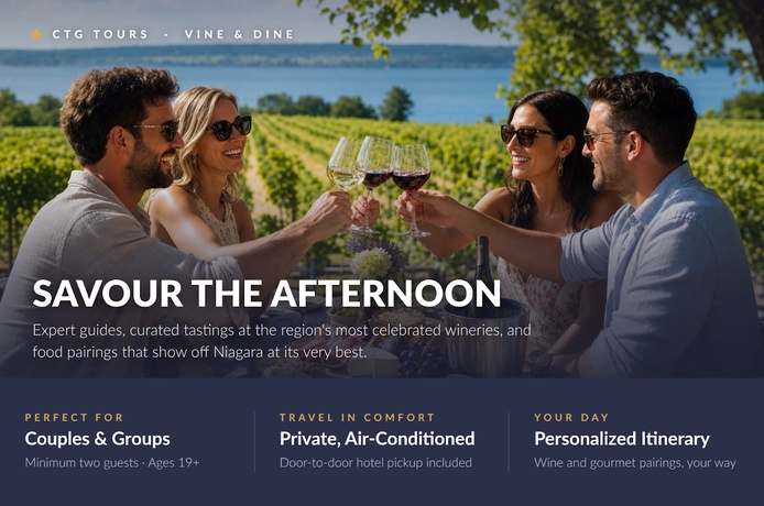 Friends toast wine at Niagara vineyard overlooking lake